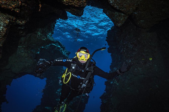 Sunlight breaking through the roof of an underwater cavern