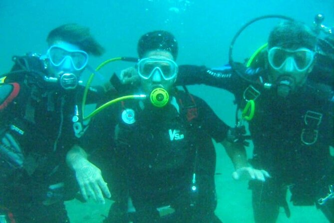 Diving experience in Polignano a Mare with certification - Passing through a cave by lamplight