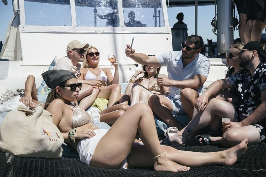 Lisbon: Catamaran Boat Party with Music, Open Bar & Dives - Open water, music, and the swimming stop