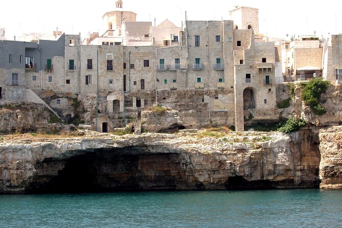Polignano a Mare boat tour emotions, caves, diving and appetizers - Lama Monachile and the final aperitivo