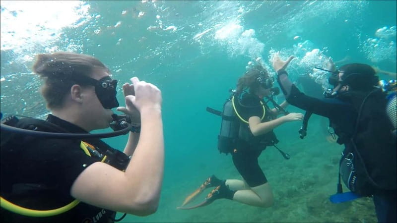 Salou: Scuba Diving for beginners with hotel pickup - Entering the Mediterranean at Salou beach