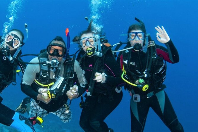 "Side: Scuba Diving in the Fascinating Underwater Museum" - The underwater museum: sculptures, ruins, and fish