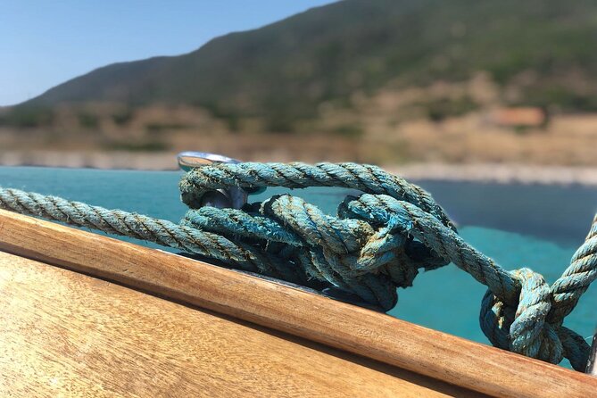 Snorkeling and Diving in the Gulf of Tavolara with Fishing - Tavolara’s cliffs, marina, and changing route